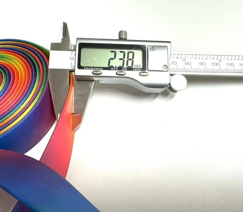 Measuring coated webbing dimensions during material sample inspection Measuring coated webbing dimensions during material sample inspection
