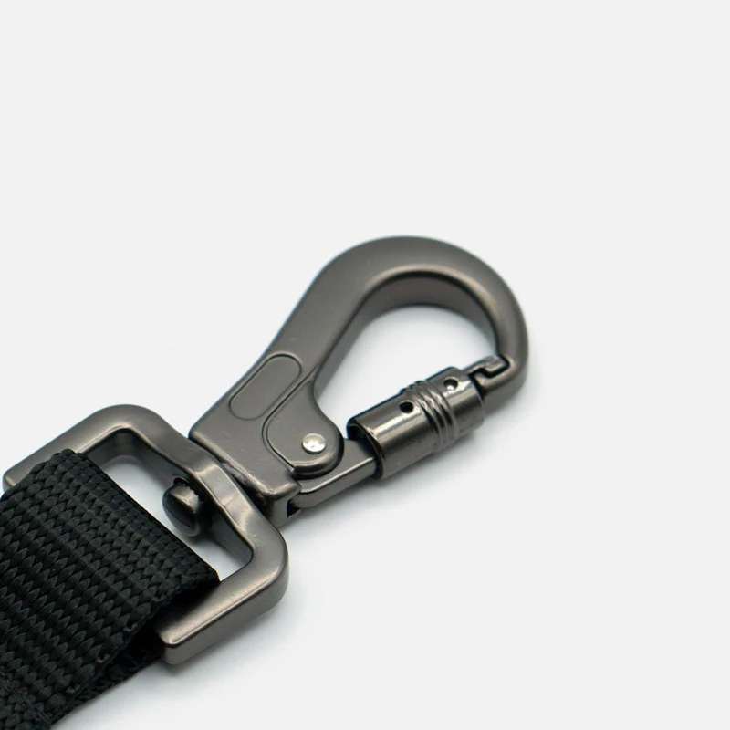 Metal swivel snap hook attached to a coated webbing dog leash Metal swivel snap hook attached to a coated webbing dog leash